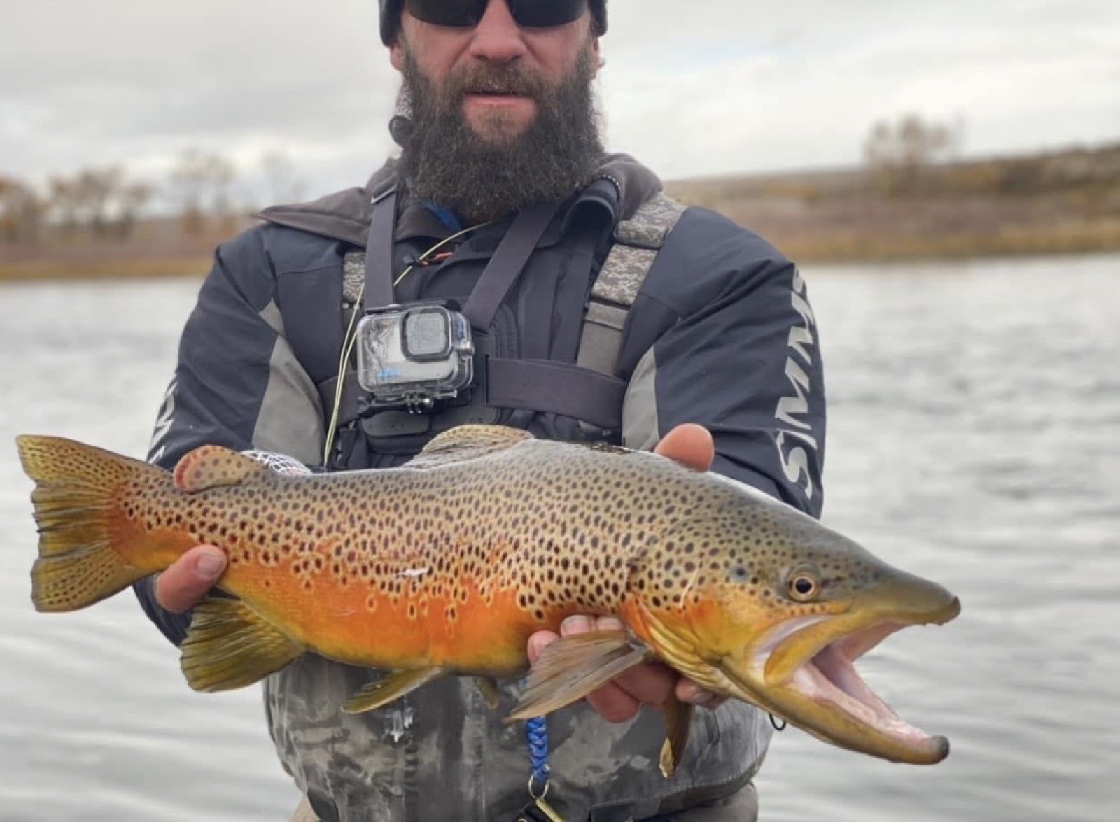 Happy angler with a beautiful trout near Rock Springs, Wyoming