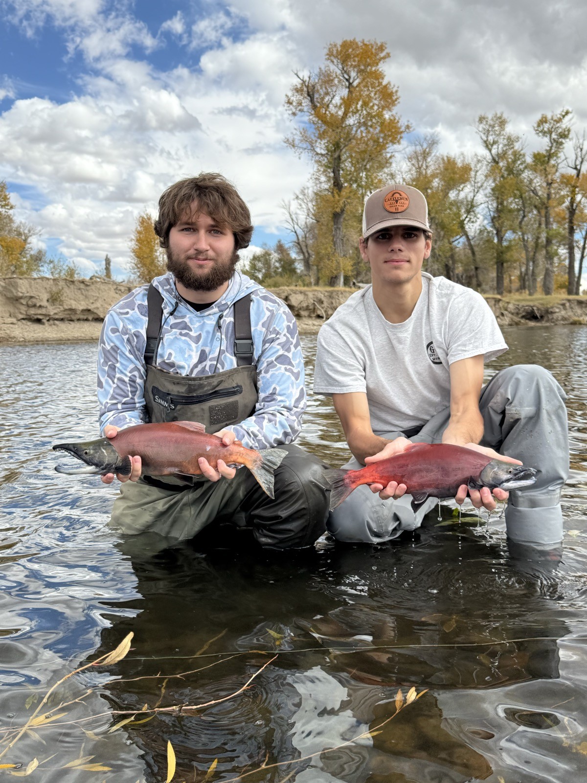 Happy angler with a beautiful trout near Rock Springs, Wyoming
