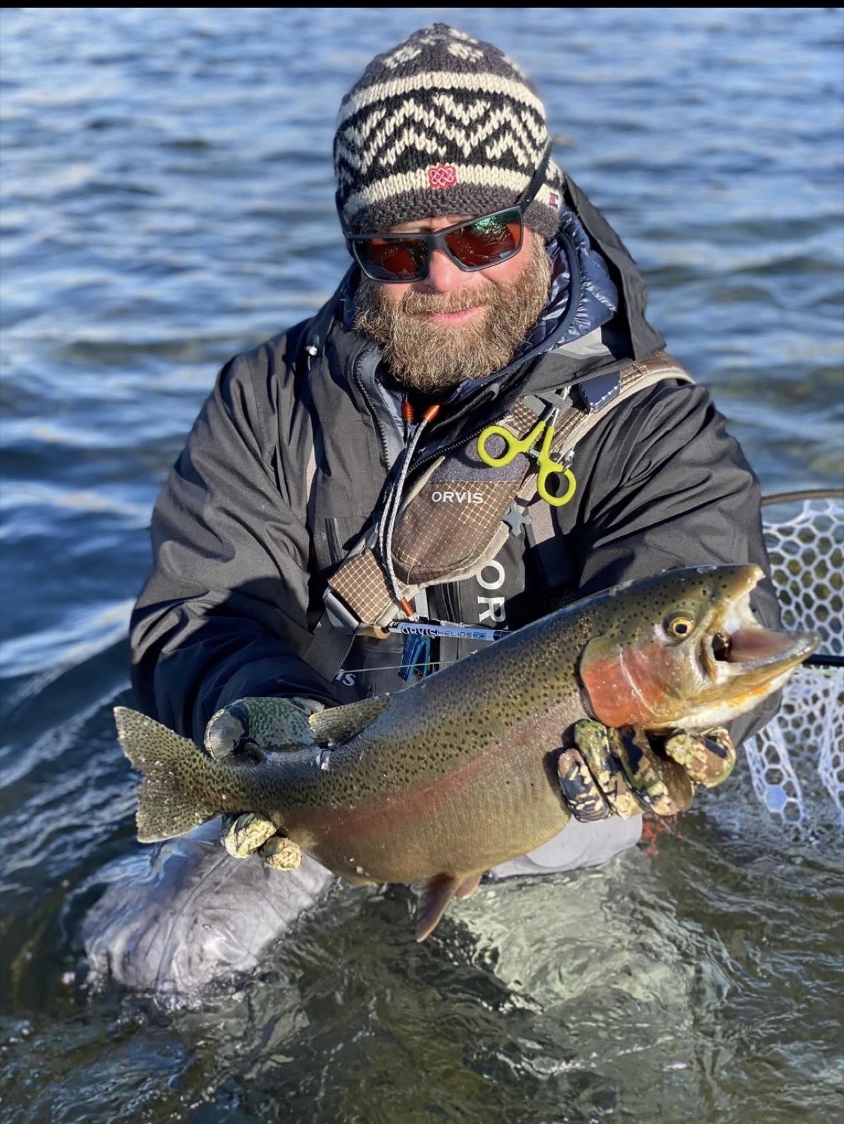 Happy angler with a beautiful trout near Rock Springs, Wyoming
