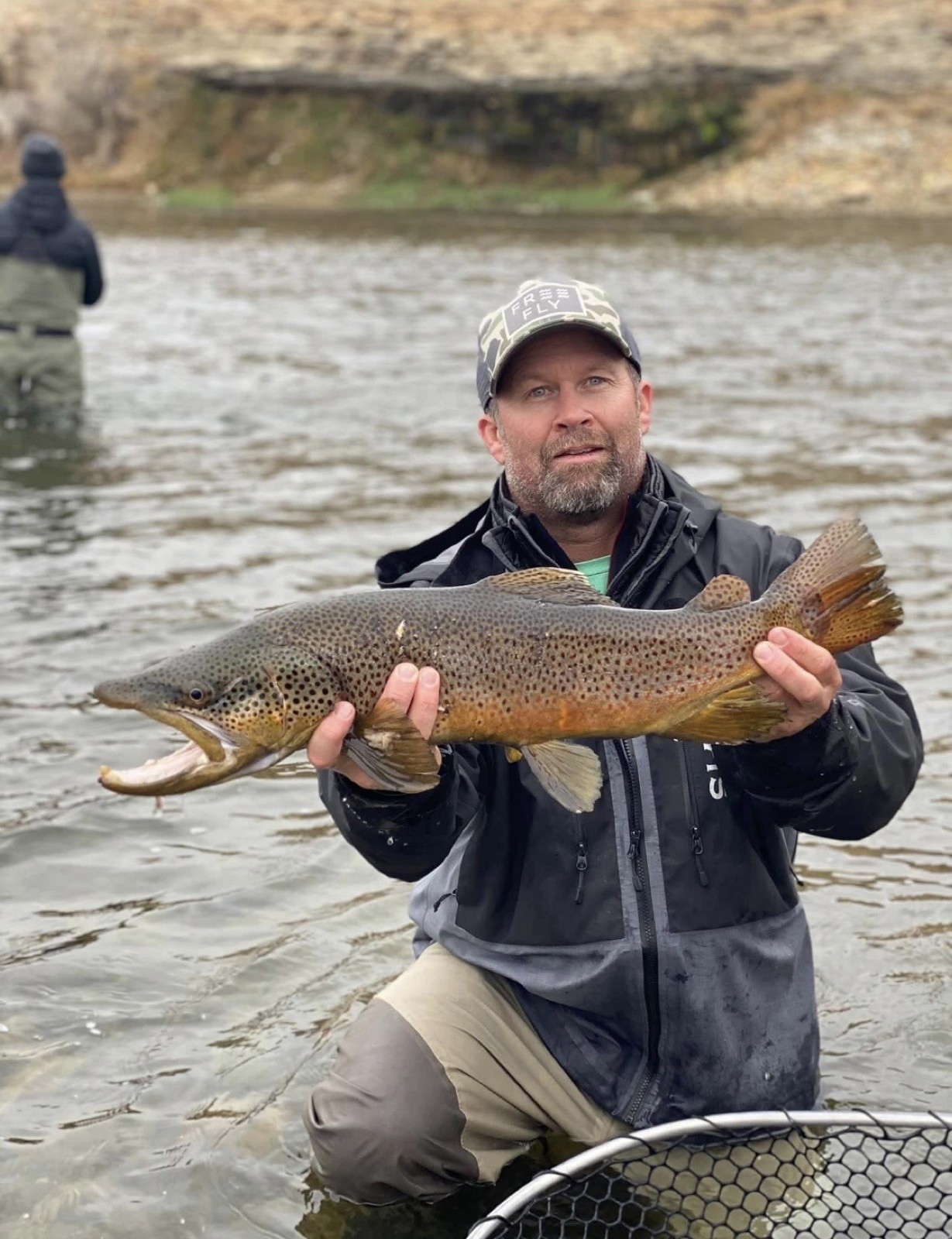 Happy angler with a beautiful trout near Rock Springs, Wyoming