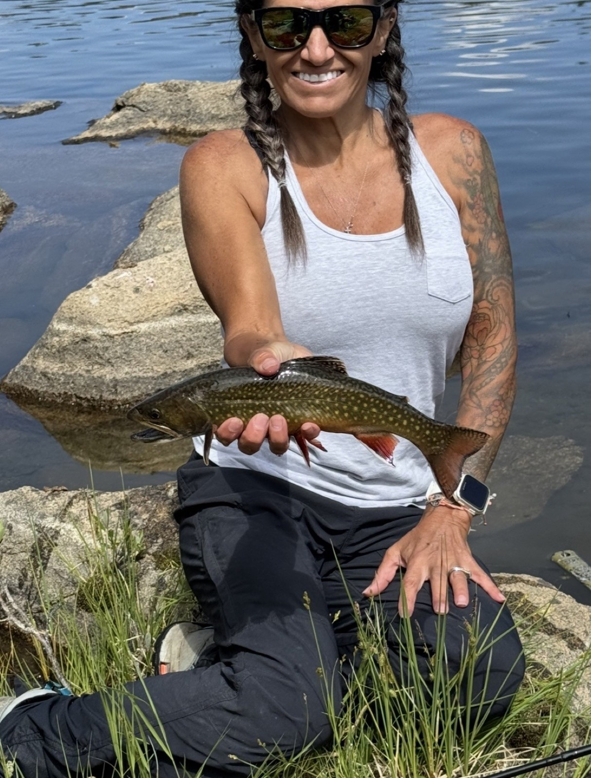 Happy angler with a beautiful trout near Rock Springs, Wyoming