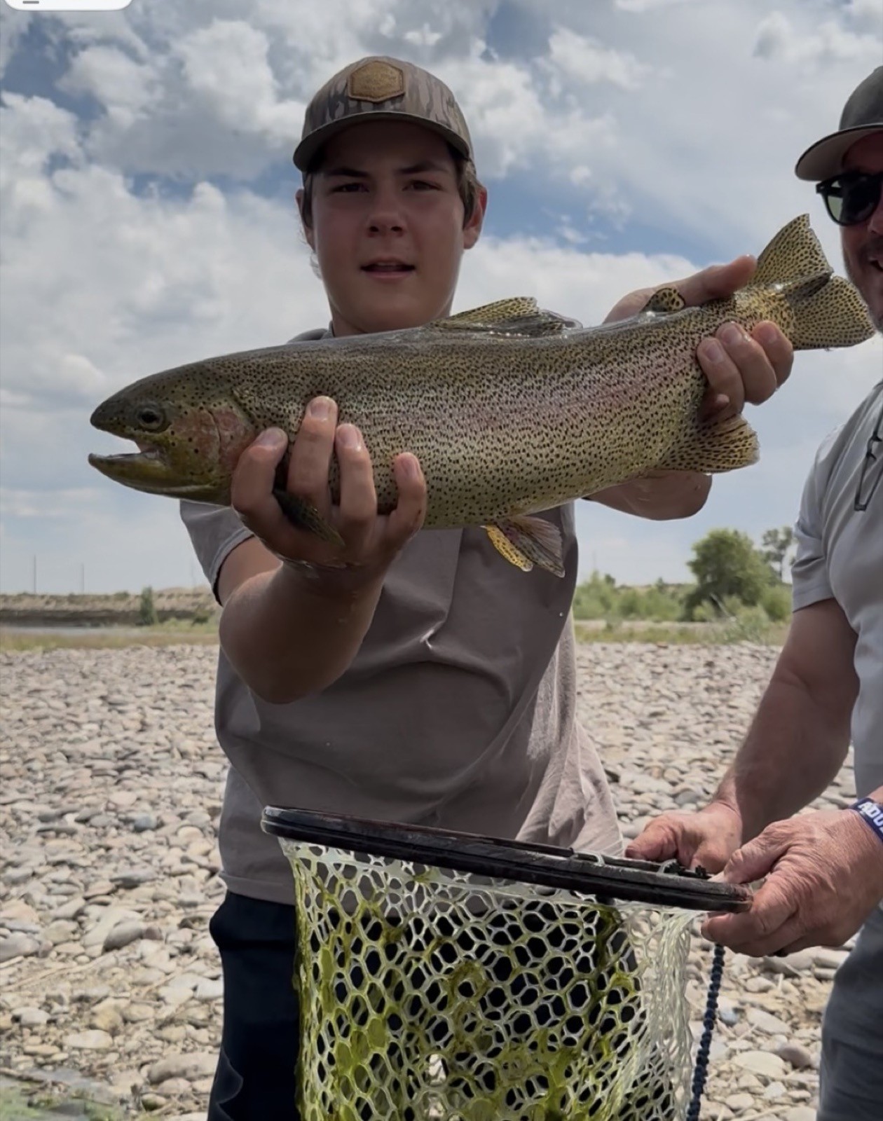 Big brown trout landed on a Wyoming river