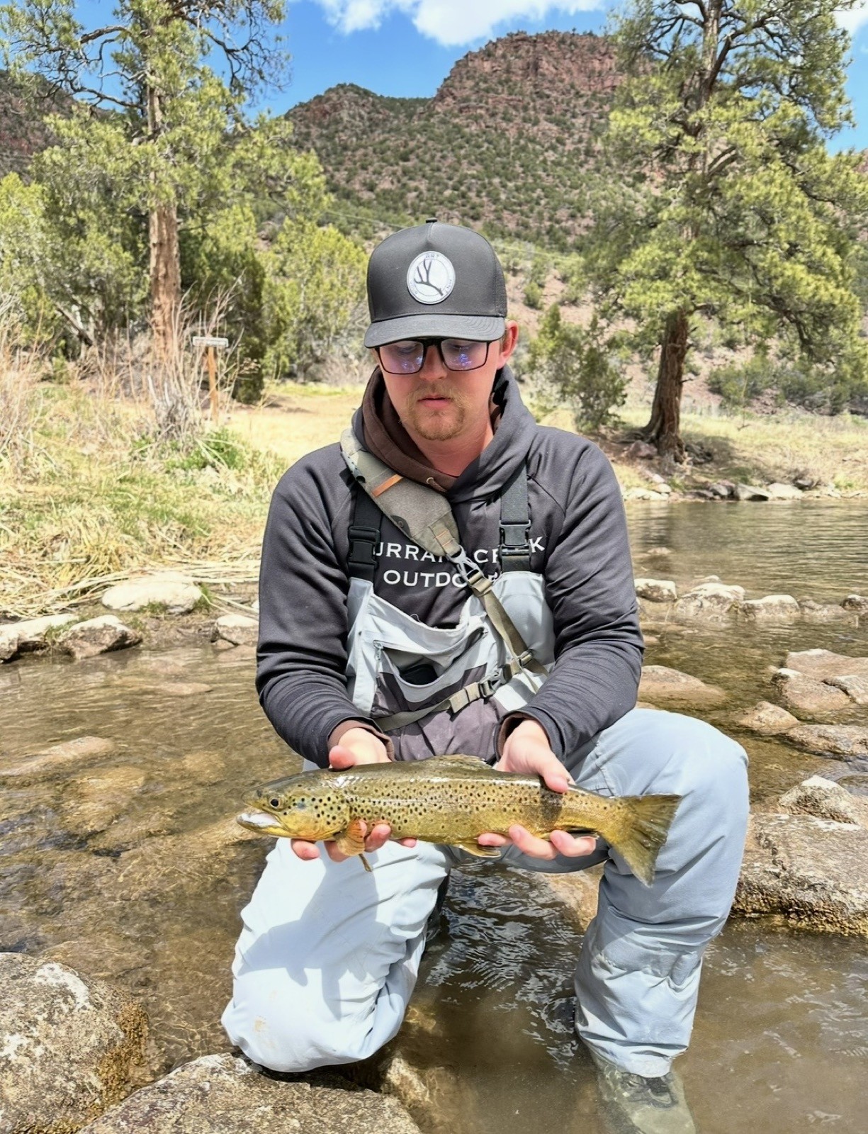 Happy angler with a beautiful trout near Rock Springs, Wyoming