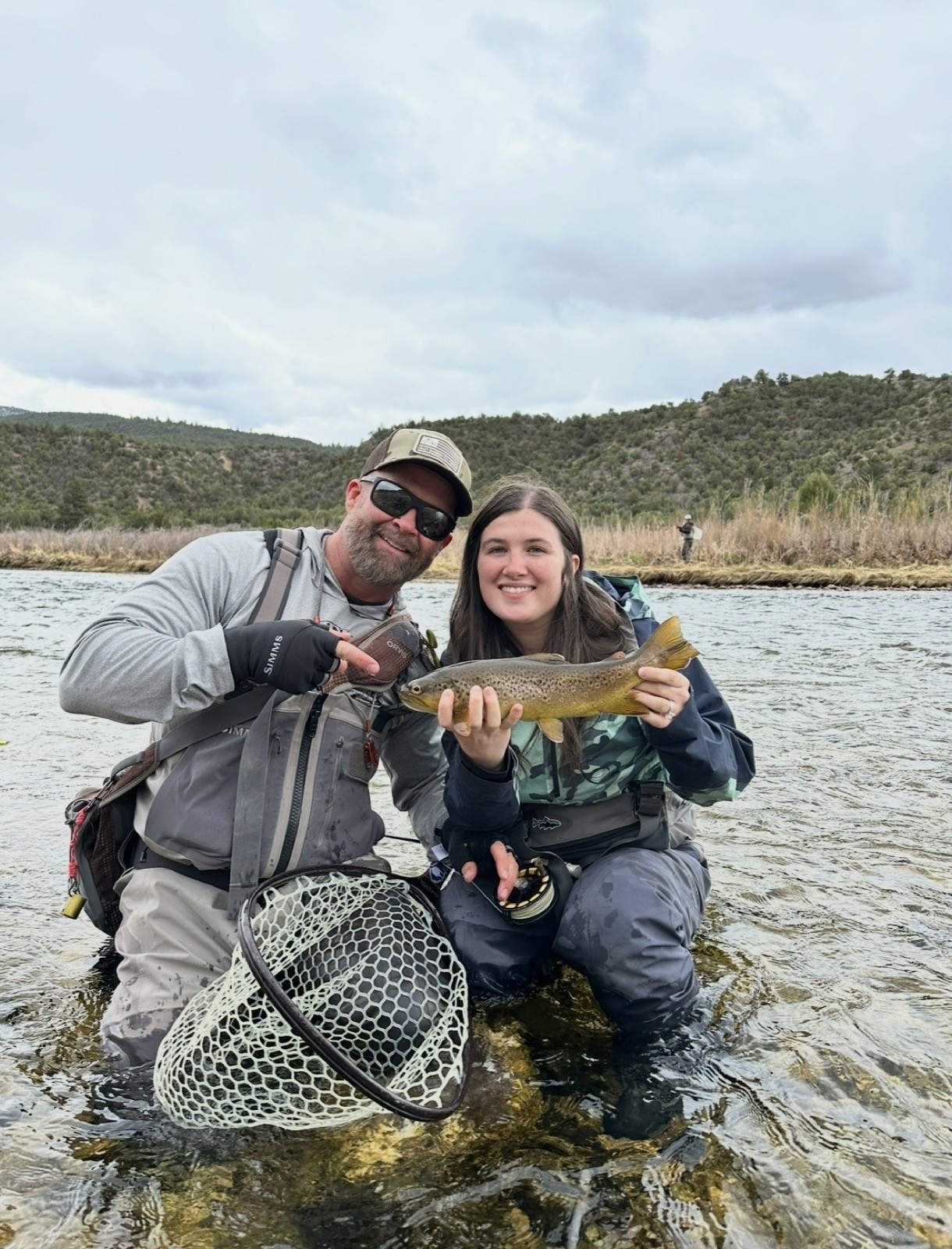 Big brown trout landed on a Wyoming river